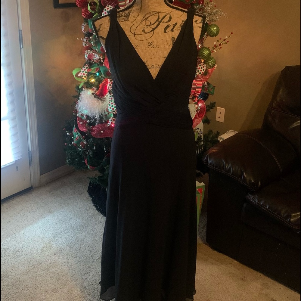 Gently used worn only once very classy black cocktail dress size 8